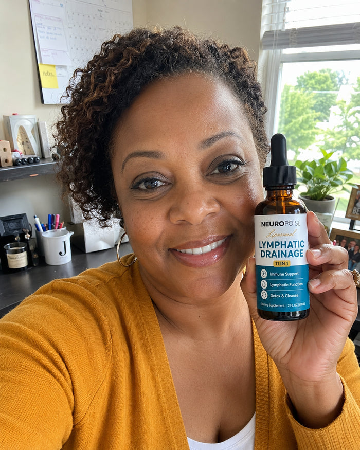 Denise K. holding her Neuropoise Lymphatic Drainage Drops bottle