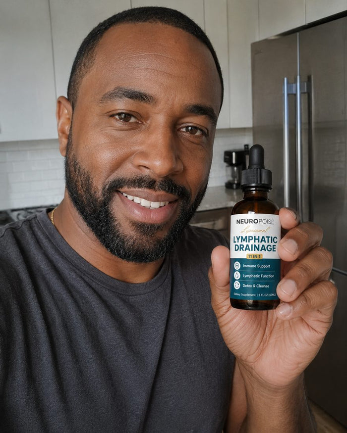 Marcus J. holding his Neuropoise Lymphatic Drainage Drops bottle